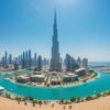 A breathtaking view of Burj Khalifa and Dubai skyline with canals, modern architecture, and tourists, perfect for a Dubai City Tour experience.