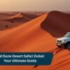 SUV parked on the stunning red sand dunes of Dubai desert during a Red Dune Desert Safari adventure.