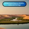 Scenic view of Al Marmoom Desert Conservation Reserve with lakes, sand dunes, and wildlife.
