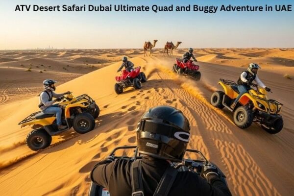 Quad bike riding across red sand dunes during an ATV desert safari in Dubai
