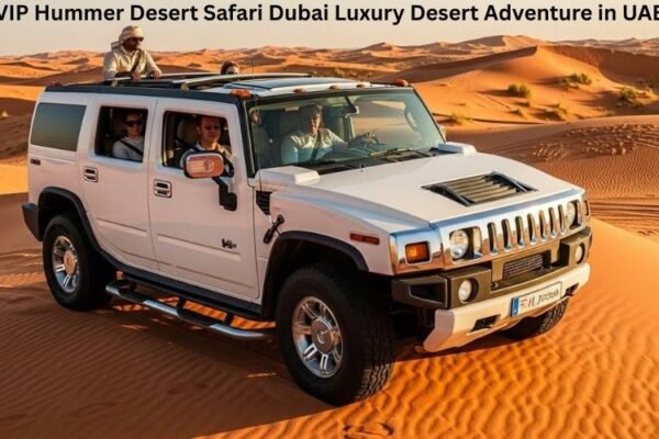 Tourists enjoying a VIP Hummer desert safari Dubai on golden dunes