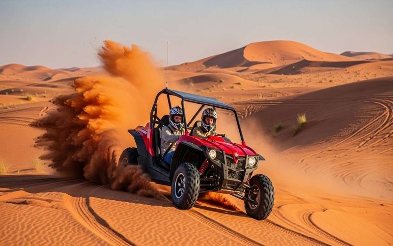 Couple-driving-a-red-dune-buggy-across-Dubai’s-Lahbab-desert-red-dunes-with-helmets,-enjoying-an-adventurous-ride.