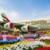 Dubai Miracle Garden travel guide showing heart tunnels, flower sculptures, and Emirates A380 floral display.