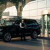 airport pickup Dubai airport pickup service luxury SUV chauffeur meet and greet airport transfer UAE arrival at Dubai International Airport